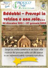 locandina informativa con forme di legno capanna e statuette del presepe 